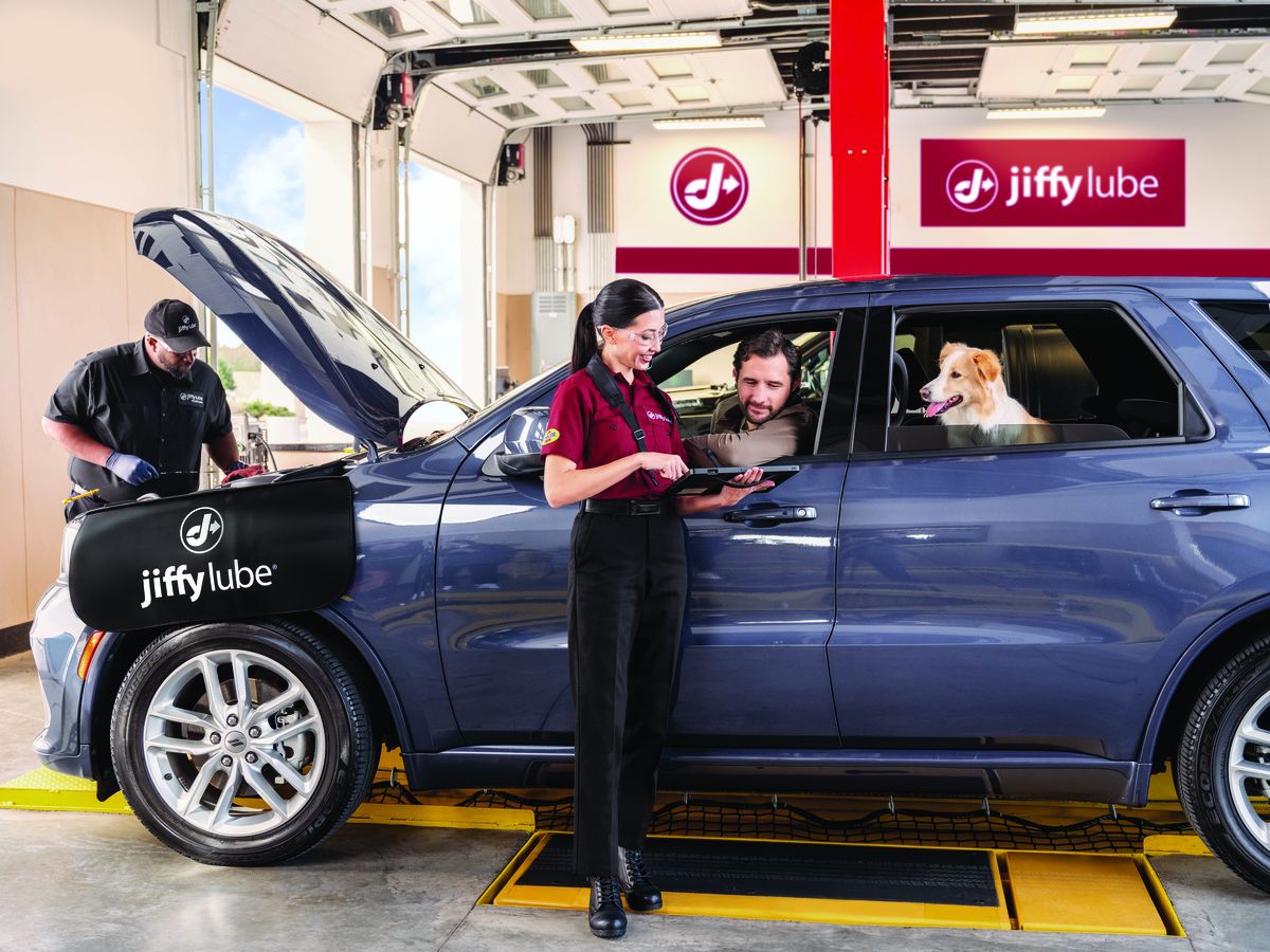 Service advisor consulting with customer